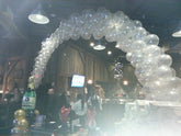 Champagne balloon arch with clear latex and mylar accents for weddings and parties